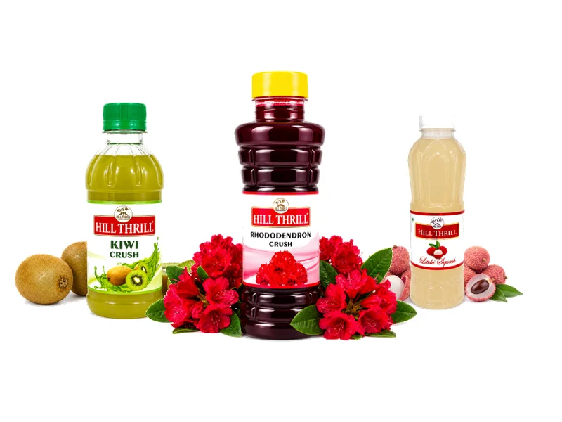 Fruit squash and crush bottles displayed with fresh fruit